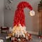 9ft. Pre-Lit Holiday Red Santa Hat Artificial Christmas Tree, White LED Lights